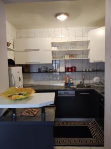 Kuchyň nebo kuchyňský kout v ubytování Apartman DG