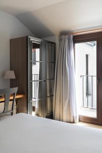Postel nebo postele na pokoji v ubytování Hotel Boutique Posada de Sillería