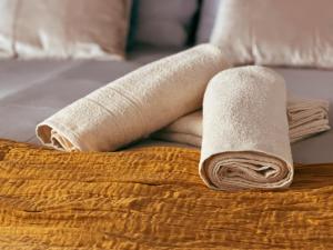 A bed or beds in a room at San Ranieri Tiny Tower
