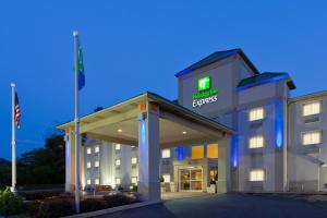 a hotel with a sign on the front of a building at Holiday Inn Express Irwin-PA Turnpike Exit 67, an IHG Hotel in Irwin