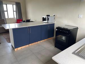 a kitchen with a counter top and a stove at No 12 Tugela Mouth in Tugela Mouth