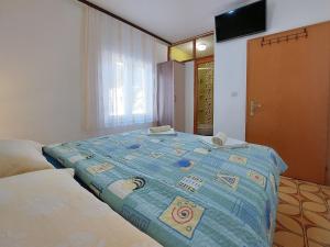 Postel nebo postele na pokoji v ubytování Apartments and Room Ivanka Petar