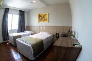 Cama o camas de una habitación en Hotel Nacional Inn Porto Alegre - Próximo ao Complexo Hospitalar Santa Casa e UFRGS