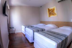 Cama o camas de una habitación en Hotel Nacional Inn Porto Alegre - Próximo ao Complexo Hospitalar Santa Casa e UFRGS