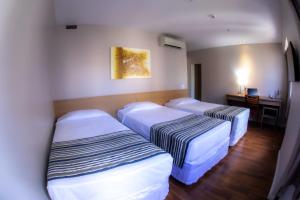 Cama o camas de una habitación en Hotel Nacional Inn Porto Alegre - Próximo ao Complexo Hospitalar Santa Casa e UFRGS