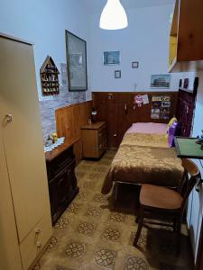 a bedroom with a bed and a table and a desk at MOMI HOUSE in Cappadocia