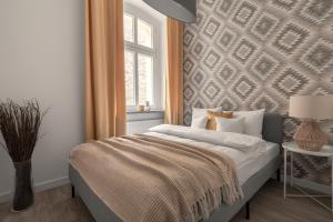 Ένα ή περισσότερα κρεβάτια σε δωμάτιο στο HARBOR APARTMENTS - Sobieskiego
