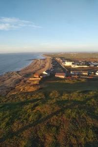 an aerial view of an island in the ocean at 2 bedroom static caravan on quiet park near Caernarfon & Snowdonia in Caernarfon