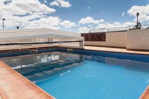 a swimming pool on top of a building at CASA MORRO BLANCO in Tías
