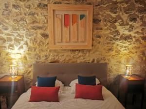 Postel nebo postele na pokoji v ubytování Bastide du Barry - Centre historique de Vallon Pont d'arc