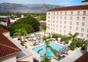 an aerial view of a hotel with a pool and palm trees at Pasadena Hotel & Pool in Pasadena