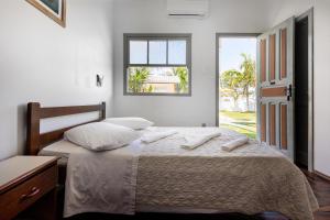 Postel nebo postele na pokoji v ubytování Rondinha Hotel