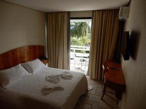Ένα ή περισσότερα κρεβάτια σε δωμάτιο στο Hotel Aojesp +39 φωτογραφίες