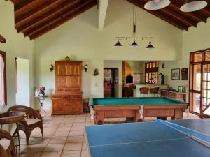 a living room with a pool table in it at Chacara Jequitiba in Itu