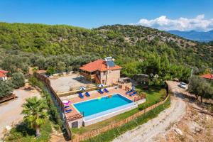 an aerial view of a house with a swimming pool at Secret Haven Villa in Fethiye