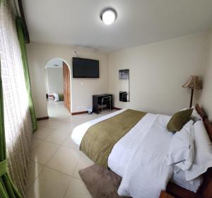 Voodi või voodid majutusasutuse Apartahotel Vincent Suites toas