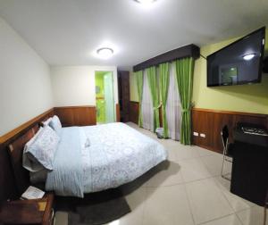 Voodi või voodid majutusasutuse Apartahotel Vincent Suites toas