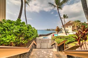 a view of the ocean from the balcony of a resort at Oceanfront Kailua-Kona Townhome with Pool and Views! in Kailua-Kona