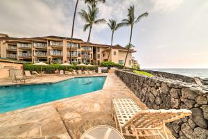 a resort with a swimming pool and the ocean at Oceanfront Kailua-Kona Townhome with Pool and Views! in Kailua-Kona