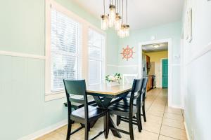 a dining room with a table and chairs at Galveston Beach Getaway #1 in Galveston