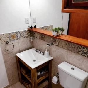 a bathroom with a sink and a toilet at Eldorado Apart in Eldorado