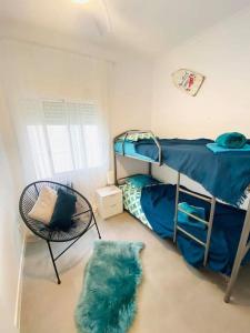A bed or beds in a room at Apartament Azul/Torrevieja