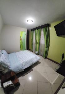 Voodi või voodid majutusasutuse Apartahotel Vincent Suites toas