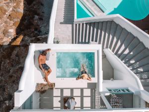 an aerial view of a house with a swimming pool at Infinity Blue Suites & Spa in Astypalaia Town