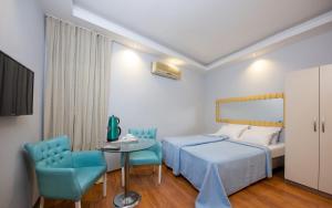 Postel nebo postele na pokoji v ubytování Gvar Apart Hotel