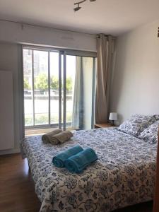 Posteľ alebo postele v izbe v ubytovaní T2 Cosy Mer Plage Plérin St Brieuc