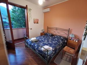 Postel nebo postele na pokoji v ubytování Villa Iris - Mondello