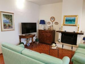 A television and/or entertainment centre at Villa Iris - Mondello