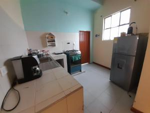 Kuchyň nebo kuchyňský kout v ubytování HOSTAL HELICONIAS