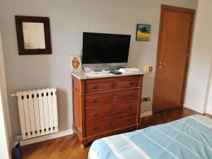 A television and/or entertainment centre at Villa Iris - Mondello