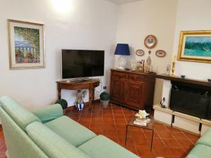 A television and/or entertainment centre at Villa Iris - Mondello