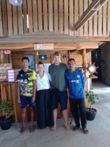 a group of people standing in front of a store at Kohjum Relax Beach in Ko Jum