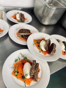 a group of plates of food on a table at The White Hart in Alton +5 photos