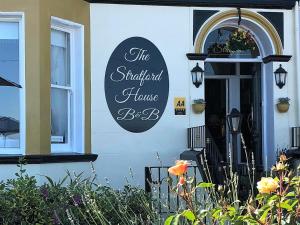 a sign on the side of a building at Stratford House Exclusively for Adults in Llandudno