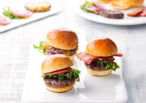 three hamburgers on buns on a white plate at Oriental Hotel Fukuoka Hakata Station in Fukuoka