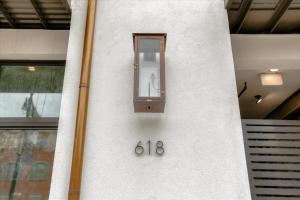 a wall with a clock on the side of a building at 3-Story Luxury Residence - French Quarter - Unit 204 in New Orleans