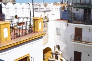 A balcony or terrace at HomeySeville-Penthouse Cathedral Tomas de Ibarra St 6 pax, Parking Optional