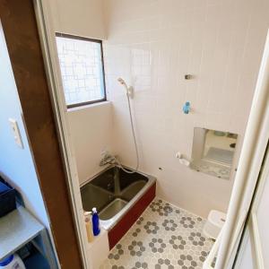 a bathroom with a sink and a toilet at mooi 宮町 in Aizuwakamatsu