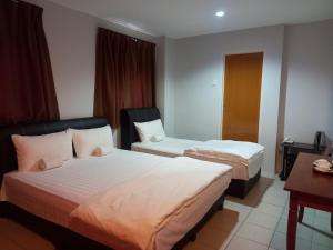 Postel nebo postele na pokoji v ubytování Reintree Lodge Hotel