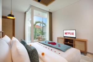 Postel nebo postele na pokoji v ubytování Eight Palms Villa Seminyak by Ini Vie Hospitality + 42 fotografií