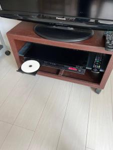 a table with a microwave and a record player at G&R House302 in Tokyo