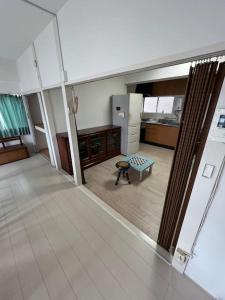 a view of a living room with a table in a room at G&R House302 in Tokyo