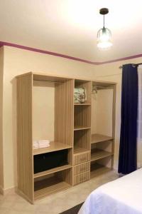 Letto o letti in una camera di Cosy and spacious apartment in Meru