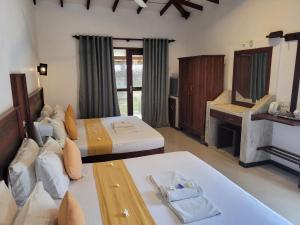 Voodi või voodid majutusasutuse Janus Paradise Rest toas