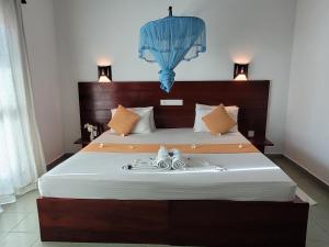 Voodi või voodid majutusasutuse Janus Paradise Rest toas