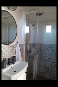 a bathroom with a sink and a shower at Petersen in Sibiu +26 photos
